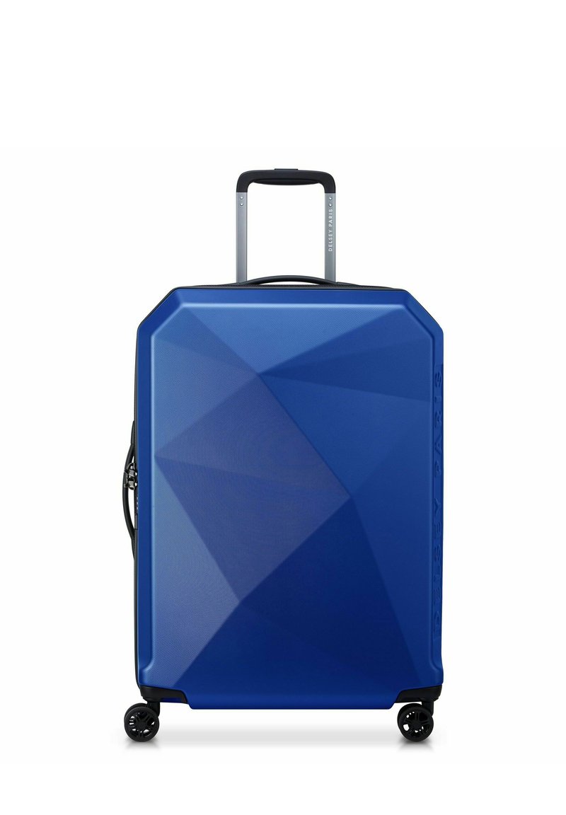 Hartschalenkoffer in Blau mit geometrischem Design, strukturiertem Finish, ausziehbarem Griff und vier Rädern für einfache Mobilität.