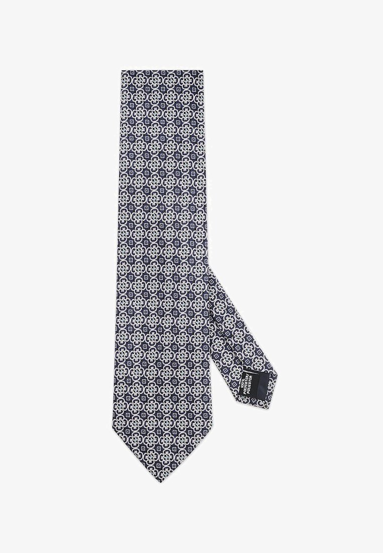 Granatowy krawat z białym geometrycznym wzorem. Gładki jedwabny materiał z ostrym końcem i metką na spodniej stronie.