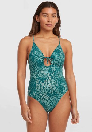 Badpak met een diepe halslijn, keyhole-detail, groen stof met een wit bladmotief, dunne verstelbare bandjes en een hoog uitgesneden broekje.