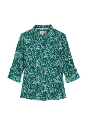 Blouse verte à motifs floraux avec un col, une texture plissée et des manches trois-quarts. Présente des motifs de fleurs blanches et violettes sur l'ensemble.