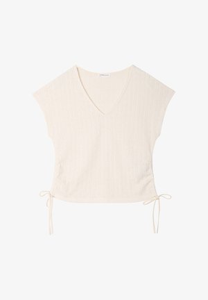 Top in maglia crema a maniche corte con scollo a V e coulisse laterali, caratterizzato da un motivo a coste sottile.