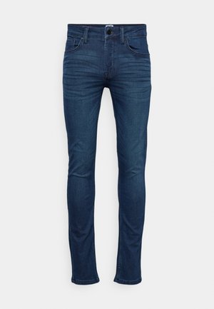Jean skinny bleu foncé en denim, avec un design classique à cinq poches, fermeture à bouton à l'avant, et un léger dégradé sur les cuisses.