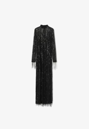 Long black dress with a high neckline, featuring fringe detailing and metallic sequins arranged in vertical lines for added texture.