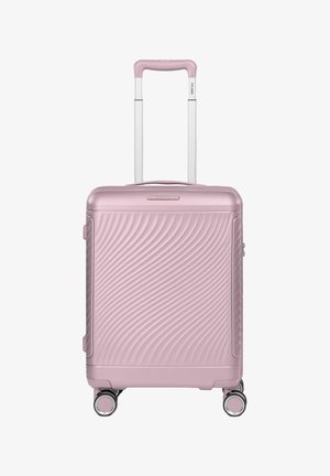 Maleta compacta rígida rosa con cuatro ruedas giratorias, un asa telescópica blanca y un patrón de ondas en el panel frontal.