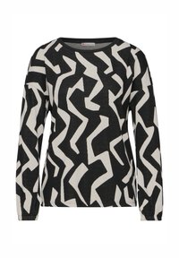 Haut à manches longues noir et blanc avec un motif zigzag abstrait, encolure ras du cou et tissu texturé. Poignets extensibles aux manches.