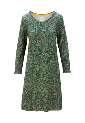 Groene bloemenjurk met lange mouwen, ronde halslijn en een getailleerde taille. Heeft meerkleurige bloemenpatronen en een gele afwerking bij de hals.