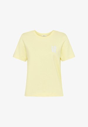 Jasnożółta, krótka bawełniana koszulka z okrągłym dekoltem, z białym haftowanym napisem "LOVE" na lewej piersi.