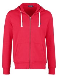 Sweat à capuche rouge avec fermeture éclair, cordons blancs, poches avant et petit logo brodé sur la poitrine gauche.