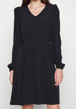 Black dress made of smooth fabric, featuring a V-neck, long puff sleeves, and an elastic waistband for a relaxed fit.