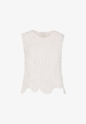 Witte mouwloze kanten top met ingewikkelde bloem- en krulpatronen en gefronste zoom, met het label "APRICOT" aan de binnenkant van de halslijn.