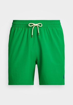 Shorts de bain verts avec une texture douce, taille élastique et cordon de serrage. Présente un petit logo bleu sur le côté inférieur.