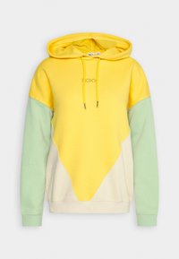 Hoodie color-block avec capuche jaune et poitrine jaune, manches vert clair, lower front crème, et cordons jaunes avec le texte "ROXY" sur la poitrine.