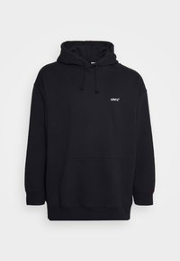 Sweat à capuche Levi’s noir avec poche avant et petit logo blanc sur la poitrine gauche, sur fond uni.
