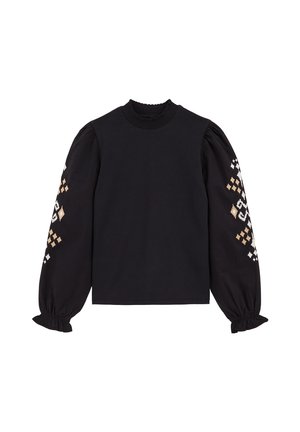 Haut noir avec encolure froncée, longues manches ballon et broderies géométriques décoratives en or et blanc sur les manches. En coton.
