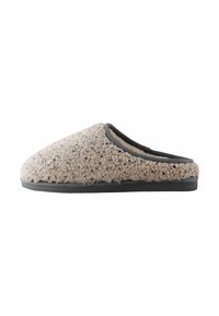 Beige wool slipper with a soft, textured upper, rounded toe, and black rubber sole, featuring a contrasting dark trim along the opening.
