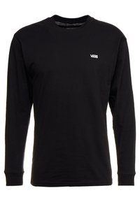 Mustan pitkähihaisen t-paidan valmistus puuvillasta, jossa on pyöreä kaula-aukko. Paidassa on pieni valkoinen "VANS" -logo rinnassa. Yksinkertainen muotoilu ja sileä rakenne.