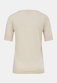 Beżowy top z krótkim rękawem i okrągłym dekoltem. Gładki materiał z kontrastowymi prążkowanymi akcentami przy rękawach i krawędzi. Prosty, minimalistyczny design.