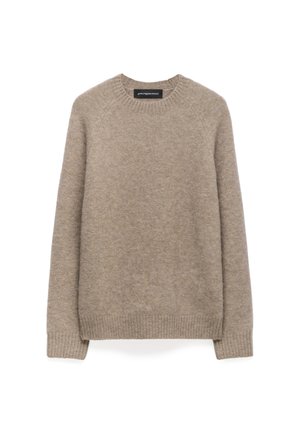 Maglione lavorato a maglia beige realizzato in morbida lana. Presenta un colletto rotondo e polsini e bordo a costine. Texture liscia con un design semplice.