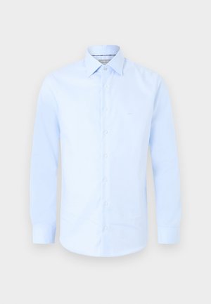 Light blue long-sleeve button-up dress shirt with a pointed collar and subtle "MK" logo on the chest center.