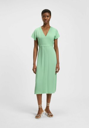 Mint green midi dress with short flutter sleeves, a deep V-neckline, and a fitted waist. Smooth fabric with a slight sheen.