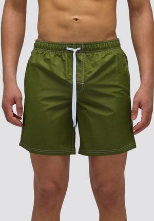 Pantaloni da mare verdi da uomo realizzati in un tessuto leggero, dotati di una vita elastica, laccetto bianco e dettagli di cucitura bianchi.
