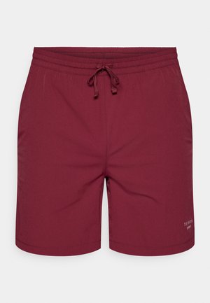 Calções de banho em bordeaux com cintura elástica e cordão. Textura suave com um logo impresso na parte inferior. Design de bainha plana.