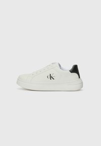 White low-top sneakers with a smooth leather upper, black heel accents, and embossed logo on the side. Rubber sole with textured grip.