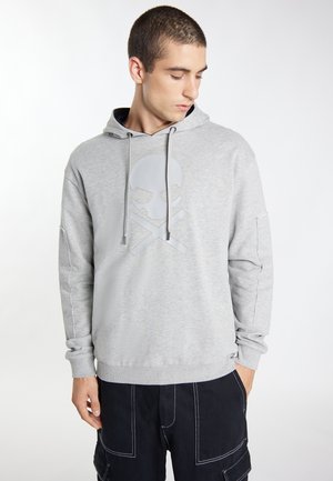Gray hooded sweatshirt with a glossy skull-and-crossbones graphic on the chest. Features long sleeves and ribbed cuffs. Worn with dark cargo shorts.