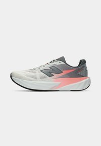 Light gray running shoe with a mesh upper, pink accents, and a cushioned white sole. Features a textured design and prominent branding.