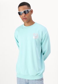 Marimekko LOISTO UNIKKO UNISEX - Melegítőfelső - turquoise