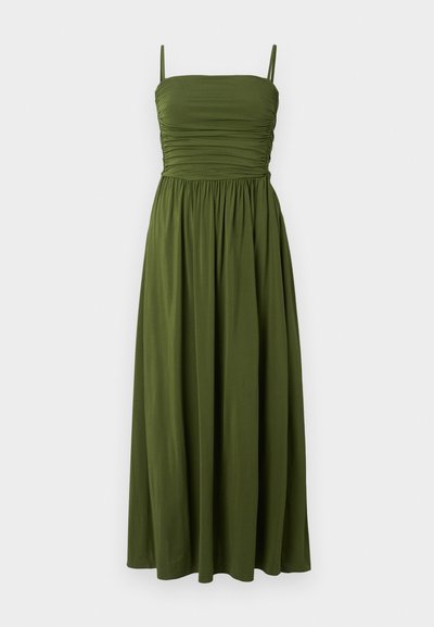 Zelené maxi šaty s tenkými ramínky, nabíraným korpusem a splývající sukní. Vyrobené z hladké tkaniny, bez vzorů, v jednobarevném provedení.