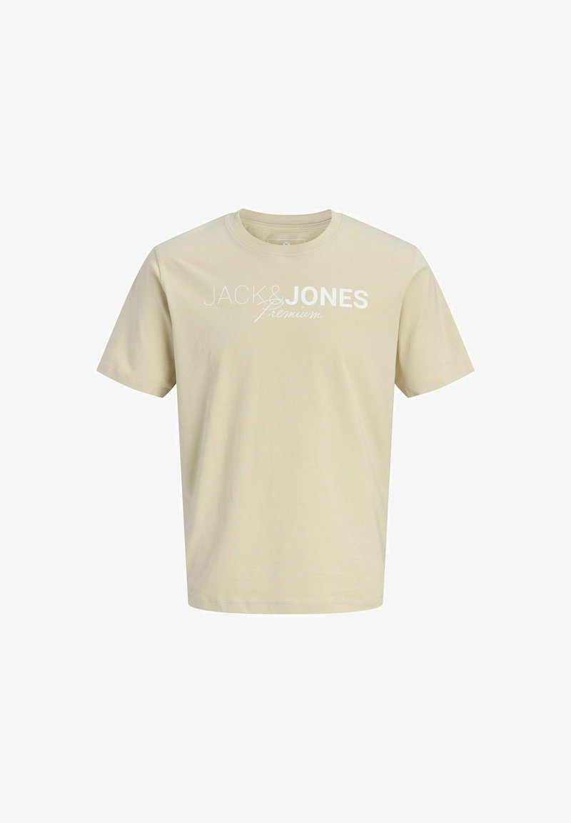 T-shirt beige à manches courtes avec col rond et texte blanc "JACK & JONES Premium" imprimé sur la poitrine.
