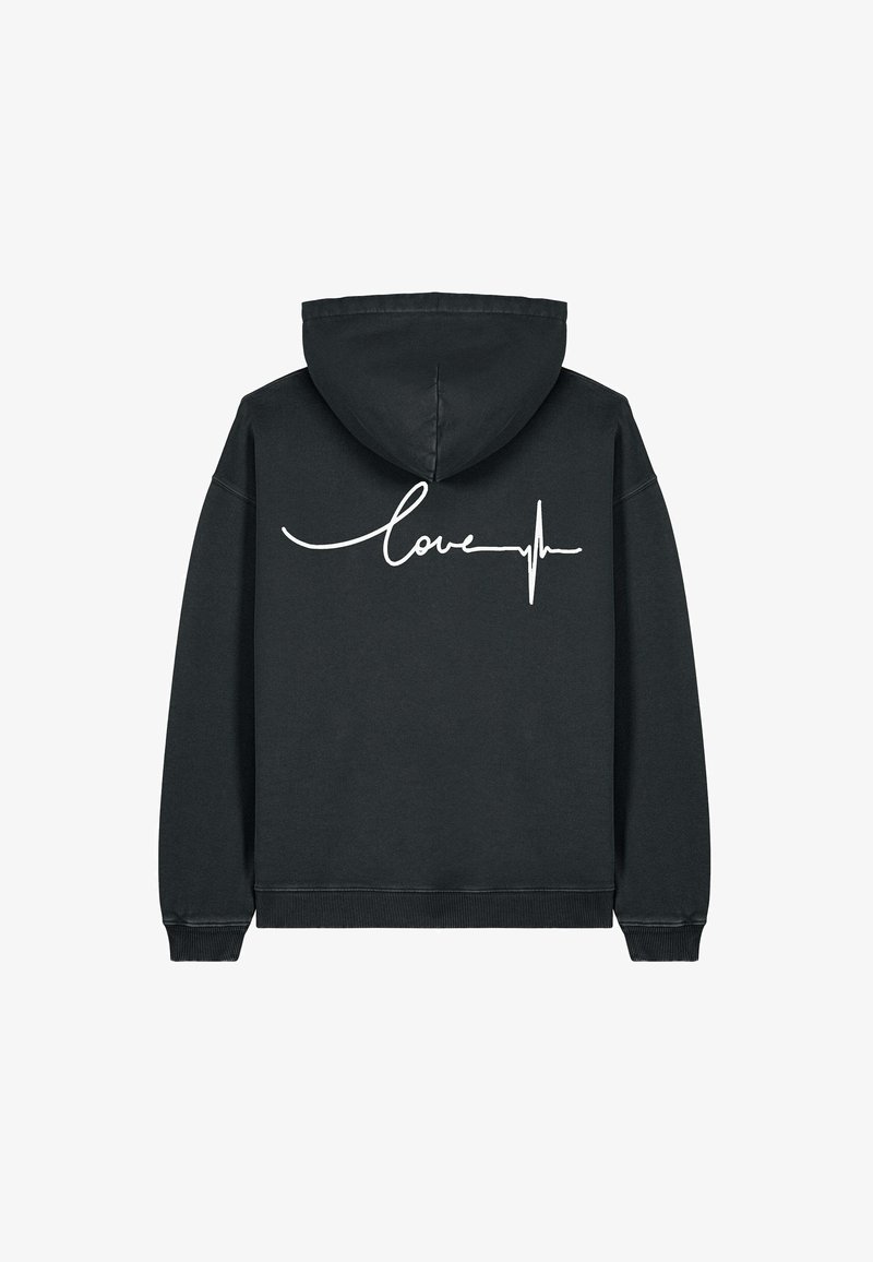 Haut à capuche noir avec un cordon de serrage, orné d'un texte en cursive blanc "love" et d'un motif de ligne de battement de cœur au dos. Texture de tissu douce.