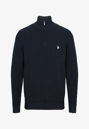 Marineblauwe ribgebreide trui met een hoge kraag en een halve rits. Bevat een klein geborduurd logo op de borst. Mouwen en zoom zijn ribgebreid.