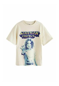 Kermansigneidalsi t-paita, jossa on graafinen printti "Stranger Things" -sarjan hahmosta, sinisin ja purppuran värisin yksityiskohdin ja lyhyet hihat.