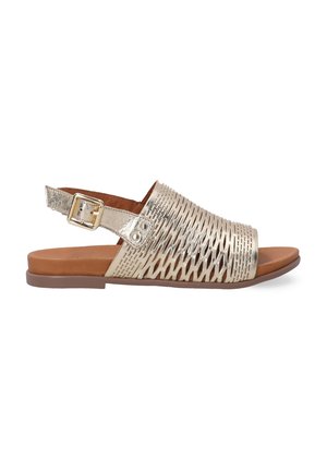 Metallic gold slingback sandals with an open toe, featuring a woven upper design and a brown, flat sole. Adjustable buckle closure at the heel.