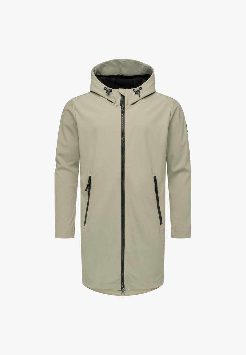 Bežs ūdensnecaurlaidīgs žakets ar kapuci, priekšējo rāvējslēdzēju un divām melnām kabatām ar rāvējslēdzējiem. Tam ir gluda tekstūra un garas piedurknes.