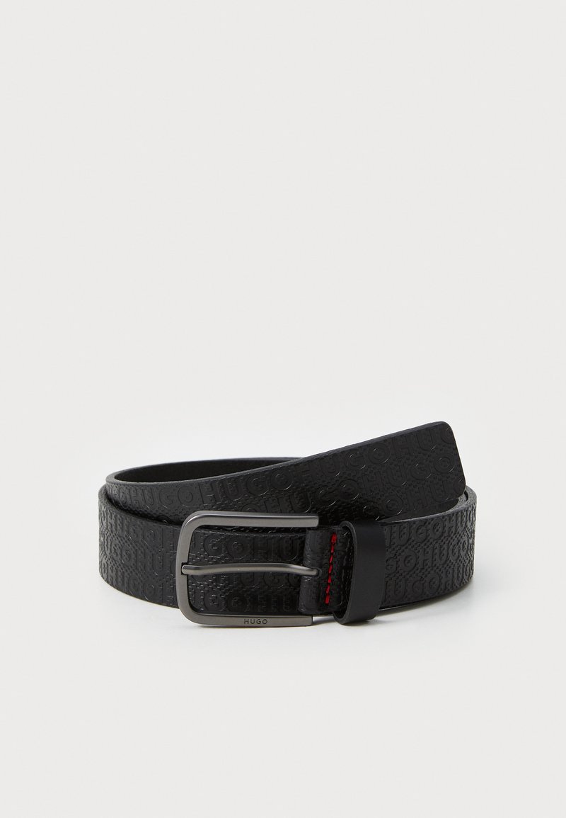 Black leather belt featuring embossed logo pattern, a silver metal buckle, and red stitching detail on the buckle strap.