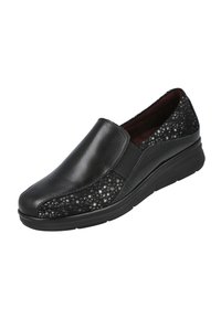 Zapatos negros tipo slip-on con una parte delantera de cuero liso y un tejido texturizado y con puntos en los laterales. Suela de goma elevada para comodidad y soporte.