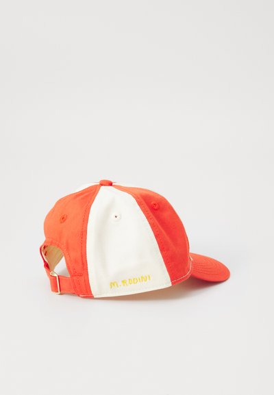 Cap with red and white panels, featuring a curved visor. "M. Rodini" embroidered in yellow on the side. Adjustable strap at the back.