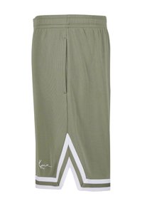 Olive green athletic shorts with a mesh texture, elastic waistband, white trim, and a chevron pattern on the hem. Features side pockets.