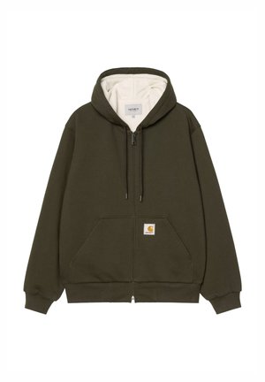 Felpa con zip verde oliva realizzata in tessuto morbido, con interno crema, tasche frontali e una piccola patch con logo sulla tasca sinistra.