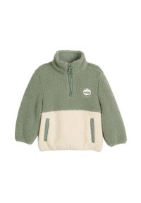 Pull en polaire vert et crème avec zip quart, col haut, poches avant et un patch circulaire présentant un design de voiture.