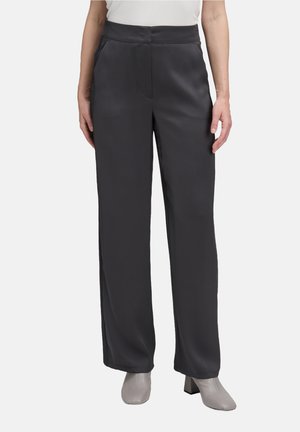 Gray, wide-leg trousers made of smooth fabric with side pockets and a concealed front zipper, paired with gray heeled boots.