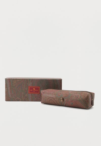 Rectangular paisley-patterned pouch with zipper next to matching box labeled "ETRO Home" in red and gold.