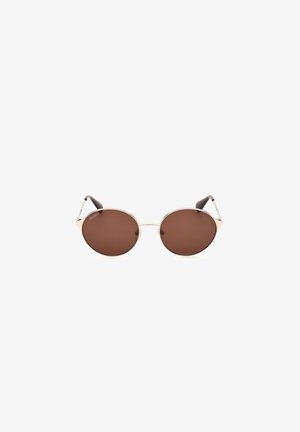 Runde Sonnenbrillen mit braunen Gläsern und einem schlanken goldenen Metallrahmen. Braune Acetat-Bügelenden für zusätzlichen Komfort und Halt.