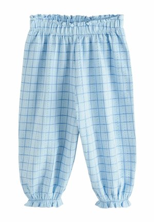 Lyseblå bukser med elastik i taljen og ved anklerne med mørkeblå ternet mønster, løs pasform og rynkede manchetter.