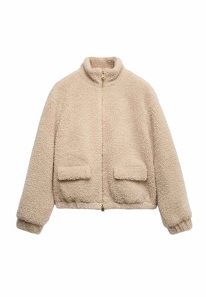 Beige kurze Jacke aus flauschigem Stoff, mit hohem Kragen, durchgehendem Reißverschluss und zwei aufgesetzten Taschen vorne.