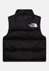 Czarna kamizelka puchowa z wysokim kołnierzem, pikowanymi panelami i białym logo "The North Face" na górnej lewej stronie. Lekki materiał.