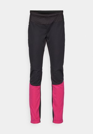 Black athletic pants with a wide black waistband, featuring bright pink accents on the lower legs, made of stretchy, smooth fabric.